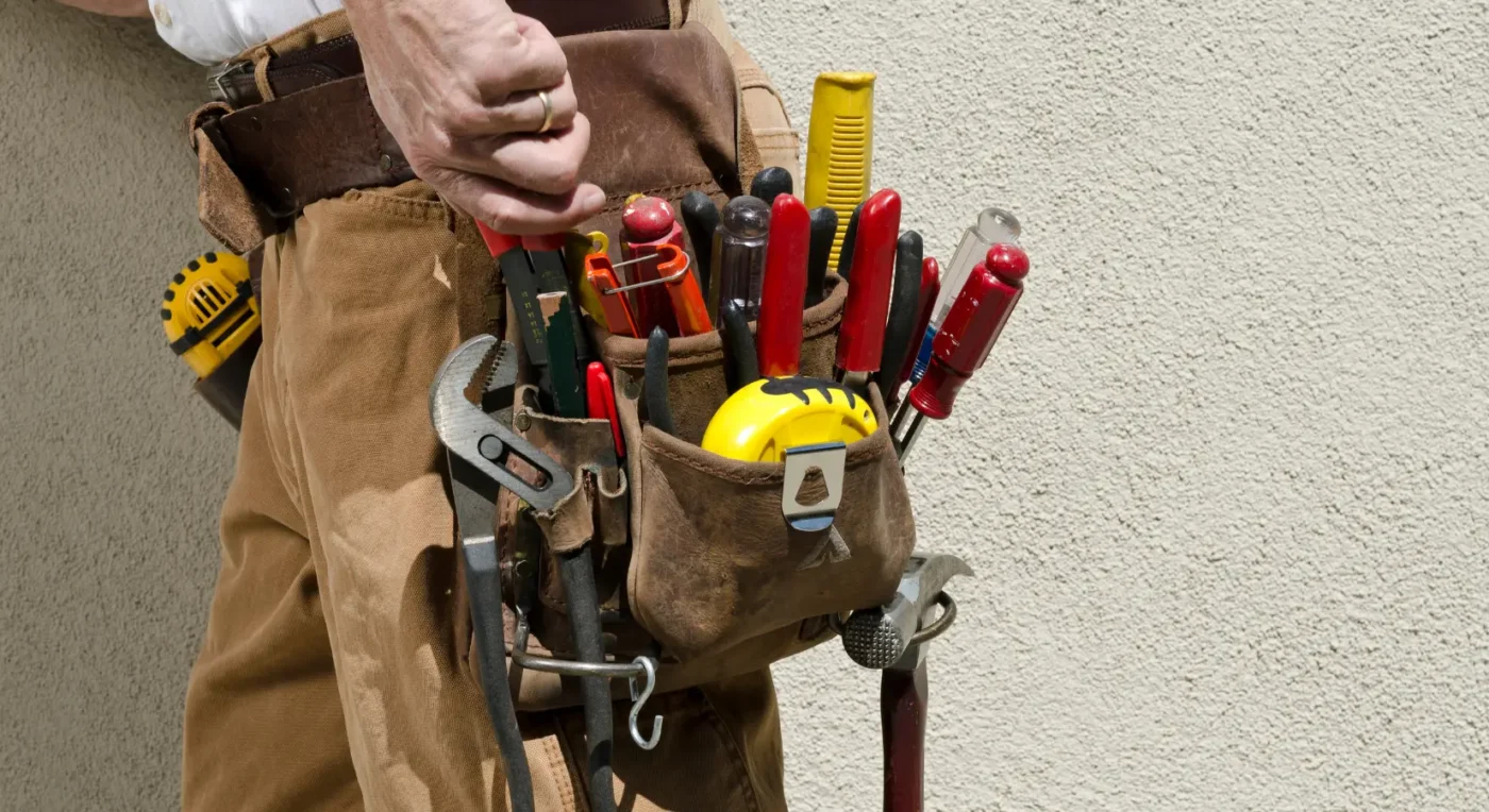 handyman with a tool belt full of tools, ready for various repair and maintenance tasks