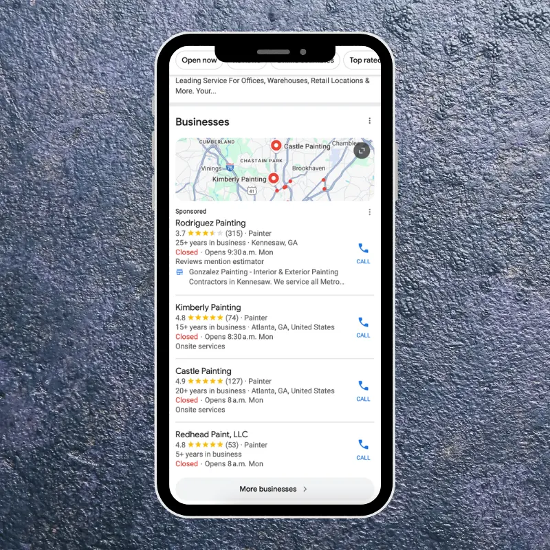mobile phone screen showing google local business listings and ads for painting services with map pins and ratings